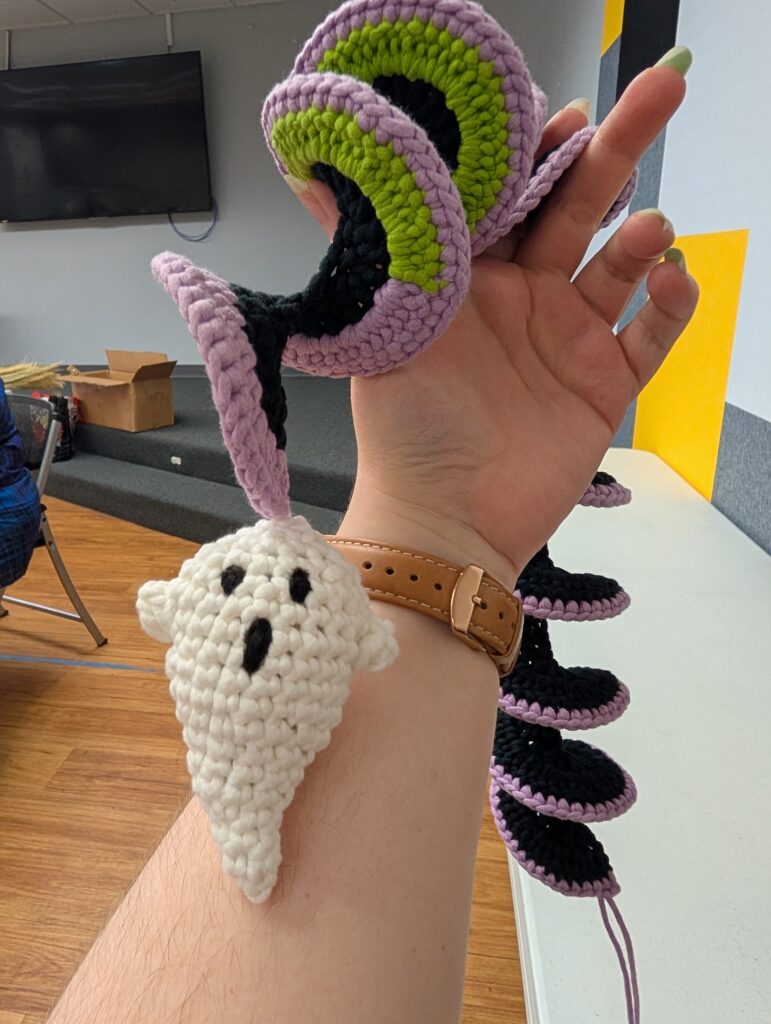 A close up picture of the ghost amigurumi at the bottom of the crochet spiral.
