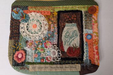 The front side of an embroidered zipper pouch in greens, oranges and blues. It features a small rug hooked depiction of a Ball mason jar, four buttons, two white crochet doilies, and two blue fabric yo-yos. It also has lots of different sashiko stitches in matching and contrasting threads.